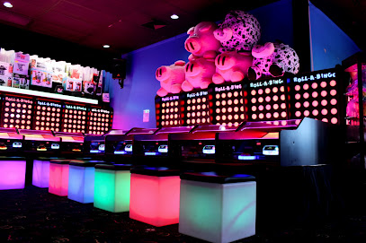 Colorful and bright roll-a-bingo machines at an arcade